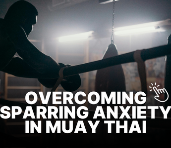 Man in dimly lit Muay Thai gym, resting on the ropes after sparring. 
