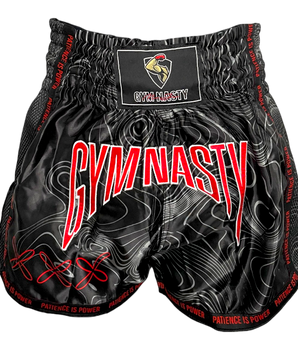 Front of black and red Muay Thai shorts with Damascus steel pattern