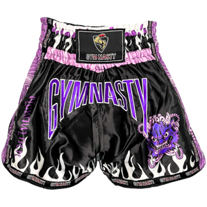 Front of purple and black muay thai shorts with mythical Thai head