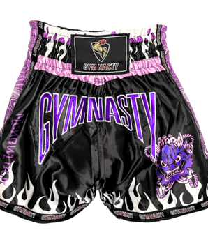 Front of purple and black muay thai shorts with mythical Thai head