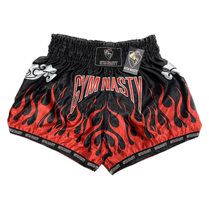 Black and red flame muay thai shorts with GYM NASTY written on the front