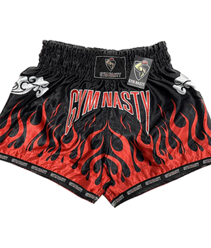 Black and red flame muay thai shorts with GYM NASTY written on the front
